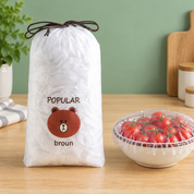 Kitchen counter par pouch aur covered bowl